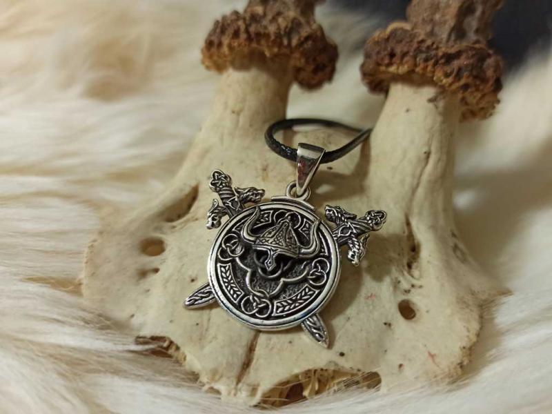 Viking helmet in the rune circle